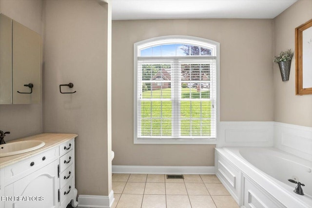 171 Forest Cove Ct, Jacksboro, TN 37757 - full bath with vanity, plenty of natural light, a garden tub, and tile patterned floors