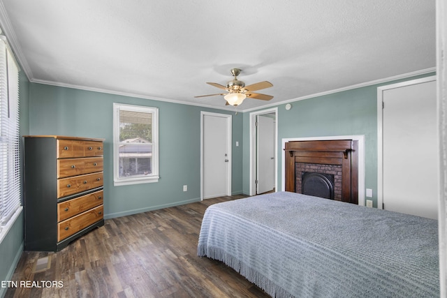 204 Queener St, Jacksboro, TN 37757 - bedroom featuring wood finished floors, crown molding, a brick fireplace, and ceiling fan