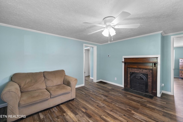 204 Queener St, Jacksboro, TN 37757 - living room with wood finished floors, a ceiling fan, a textured ceiling, a brick fireplace, and crown molding