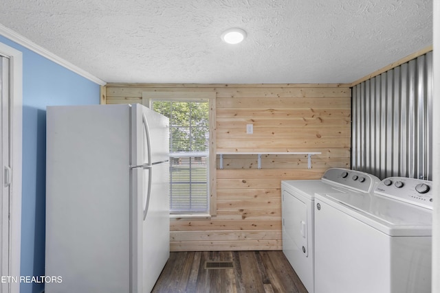 204 Queener St, Jacksboro, TN 37757 - laundry room with ornamental molding, a textured ceiling, dark wood-style flooring, washing machine and clothes dryer, and wooden walls
