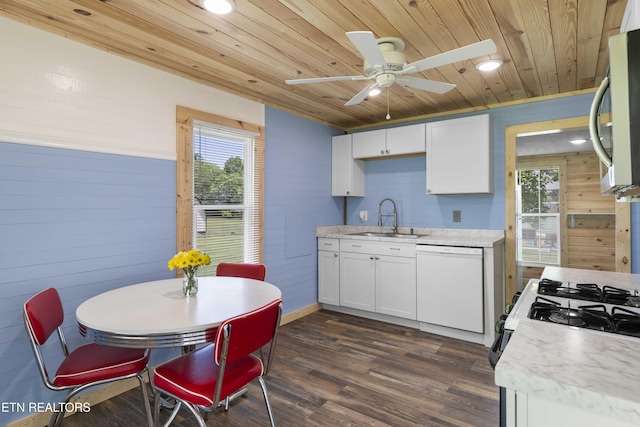 204 Queener St, Jacksboro, TN 37757 - kitchen with white appliances, wooden ceiling, wood walls, light countertops, and a ceiling fan