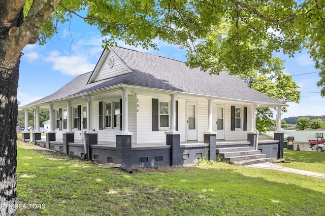 204 Queener St, Jacksboro, TN 37757 - view of front of property with covered porch, a shingled roof, and a front yard