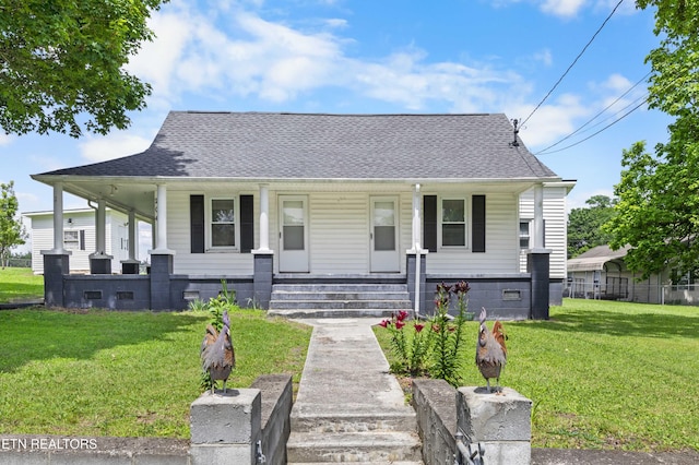 204 Queener St, Jacksboro, TN 37757 - view of front of home with a porch, a front lawn, and roof with shingles