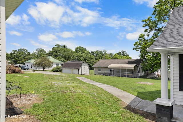 204 Queener St, Jacksboro, TN 37757 - view of yard featuring a storage shed and a garage