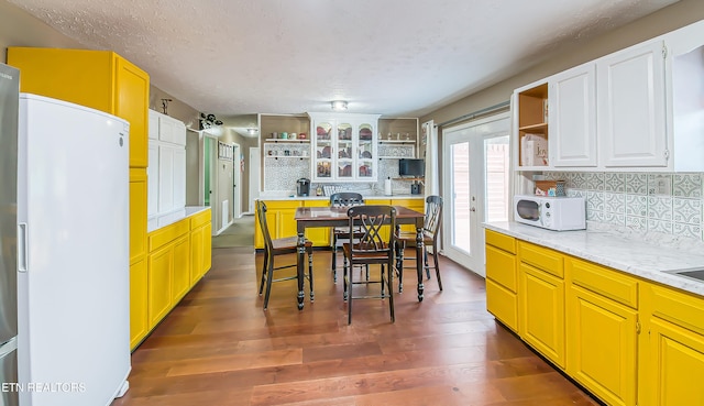 181 Overlook Ln, Jacksboro, TN 37757 - dining room featuring a textured ceiling and dark wood finished floors