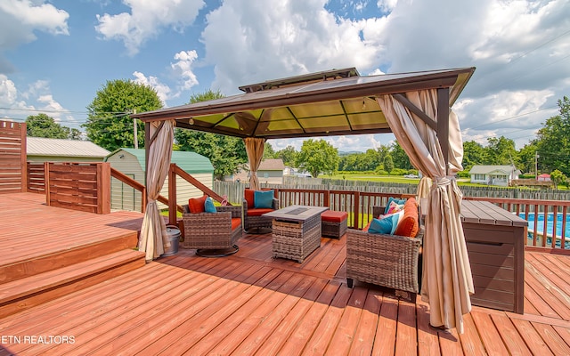 181 Overlook Ln, Jacksboro, TN 37757 - wooden terrace with a fenced backyard, a gazebo, a storage unit, and an outdoor hangout area