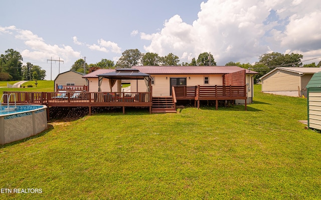 181 Overlook Ln, Jacksboro, TN 37757 - back of property featuring a deck, an outdoor pool, a gazebo, and a metal roof