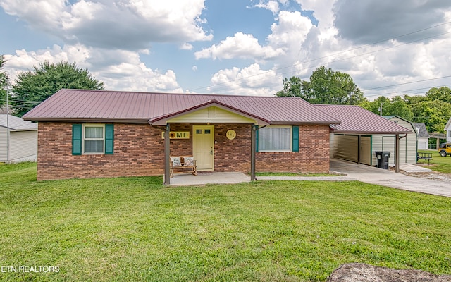 181 Overlook Ln, Jacksboro, TN 37757 - ranch-style house with concrete driveway, brick siding, a metal roof, and a front lawn