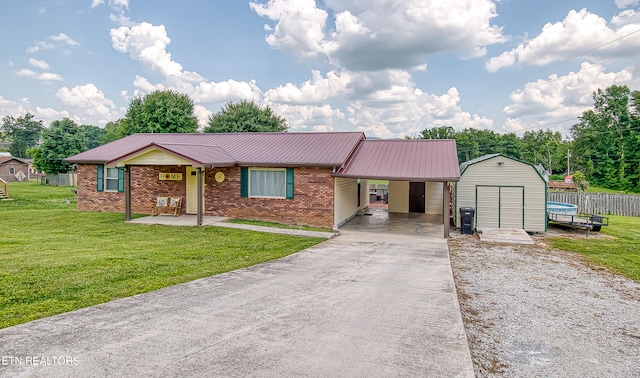 181 Overlook Ln, Jacksboro, TN 37757 - single story home featuring an attached carport, concrete driveway, a metal roof, brick siding, and a storage unit