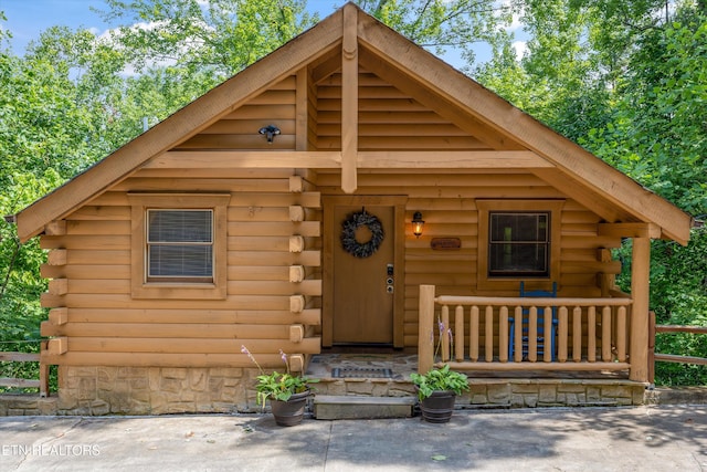 1235 Honeysuckle Ln, Sevierville, TN 37876 - log cabin featuring log exterior and covered porch