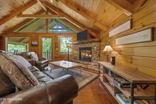 1235 Honeysuckle Ln, Sevierville, TN 37876 - living area featuring wood walls, hardwood / wood-style floors, a stone fireplace, plenty of natural light, and wood ceiling