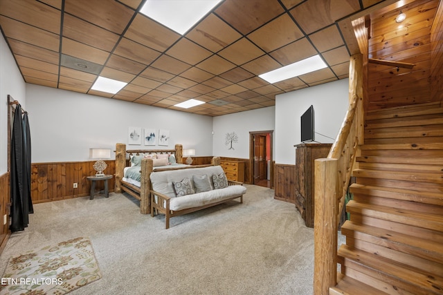 1235 Honeysuckle Ln, Sevierville, TN 37876 - bedroom featuring a wainscoted wall, wooden walls, carpet flooring, and a paneled ceiling
