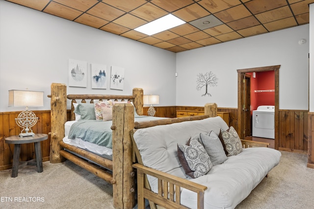 1235 Honeysuckle Ln, Sevierville, TN 37876 - carpeted bedroom with washer / clothes dryer, wainscoting, and wood walls