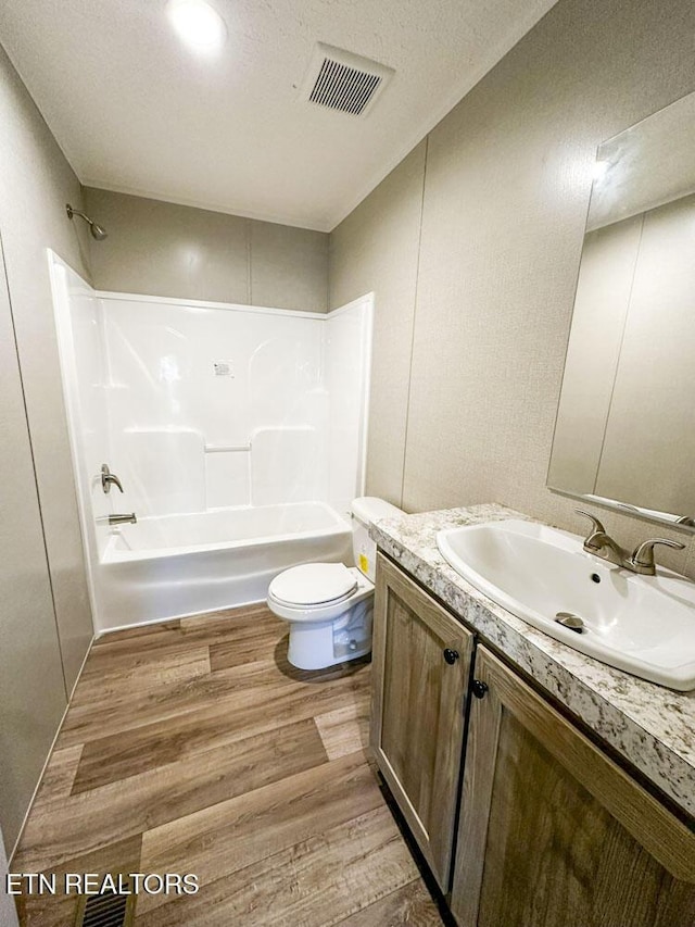 338 Bungalow Dr, Dandridge, TN 37725 - full bath with wood finished floors, vanity, and washtub / shower combination