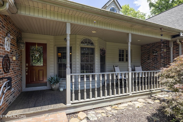 302 Lake St, Harriman, TN 37748 - view of exterior entry with a porch and brick siding