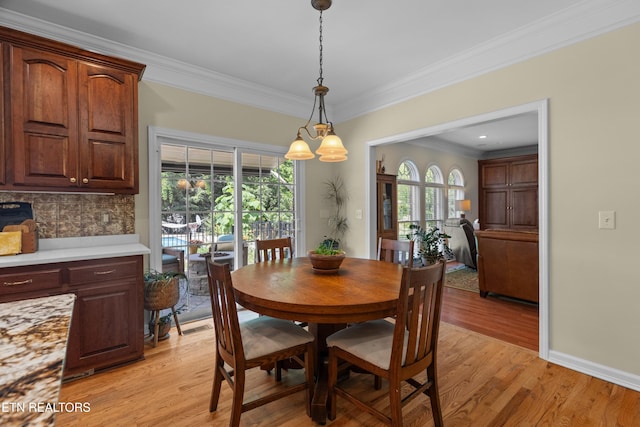 112 Reed Cir, Johnson City, TN 37601 - dining area featuring ornamental molding, light wood finished floors, and healthy amount of natural light
