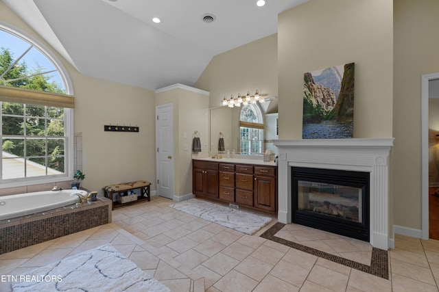112 Reed Cir, Johnson City, TN 37601 - full bathroom featuring high vaulted ceiling, vanity, a bath, a fireplace with flush hearth, and recessed lighting