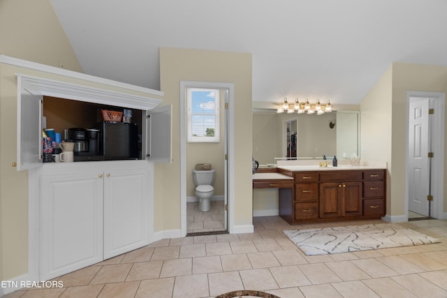 112 Reed Cir, Johnson City, TN 37601 - bathroom with vanity, tile patterned flooring, and vaulted ceiling