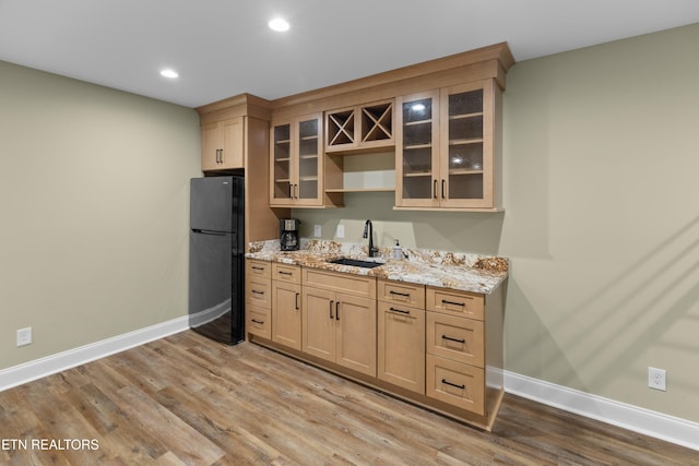112 Reed Cir, Johnson City, TN 37601 - kitchen featuring freestanding refrigerator, light wood-style floors, light stone counters, glass insert cabinets, and recessed lighting