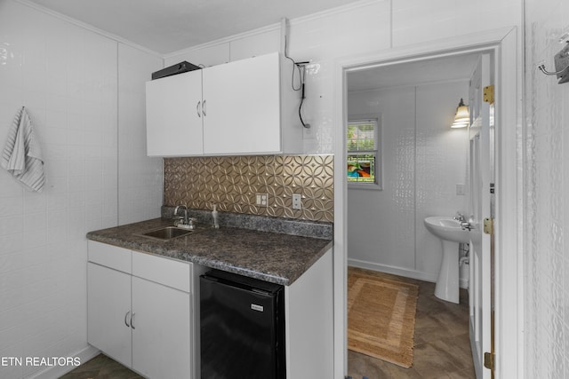 112 Reed Cir, Johnson City, TN 37601 - kitchen featuring dark countertops, crown molding, white cabinetry, refrigerator, and tasteful backsplash