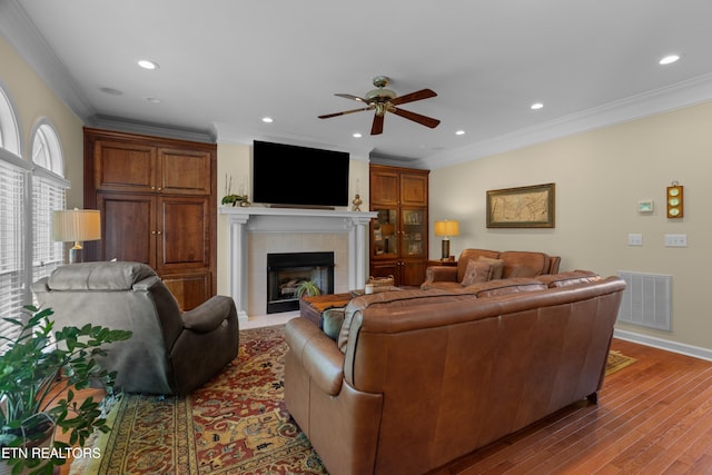 112 Reed Cir, Johnson City, TN 37601 - living area with ceiling fan, a tile fireplace, wood finished floors, recessed lighting, and crown molding