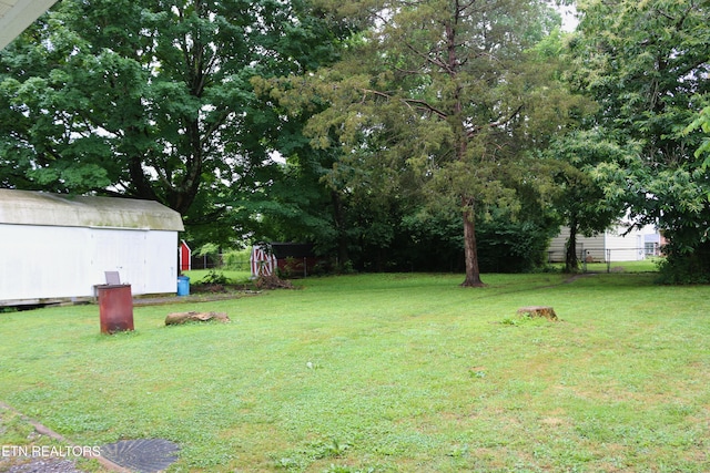 8025 Sharp Rd, Powell, TN 37849 - view of yard with a storage unit