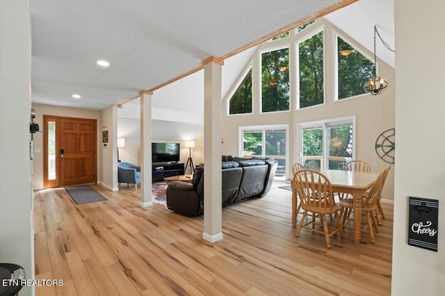 824 Deerfield Way, Lafollette, TN 37766 - living area featuring light wood finished floors, a textured ceiling, recessed lighting, high vaulted ceiling, and a chandelier