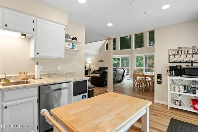 824 Deerfield Way, Lafollette, TN 37766 - kitchen with stainless steel appliances, light wood finished floors, white cabinetry, open shelves, and recessed lighting