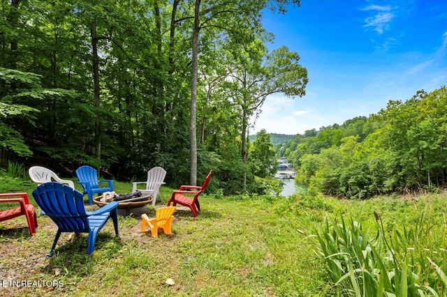 824 Deerfield Way, Lafollette, TN 37766 - view of yard featuring a fire pit, a forest view, and a water view