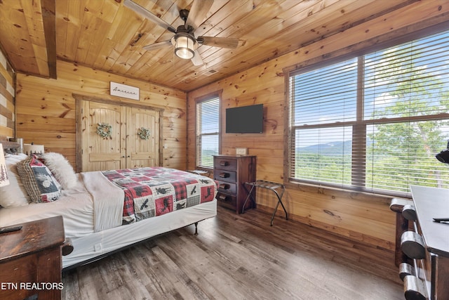 3169 Bear Mountain Ln, Sevierville, TN 37876 - bedroom featuring multiple windows, wooden walls, wood ceiling, and wood finished floors