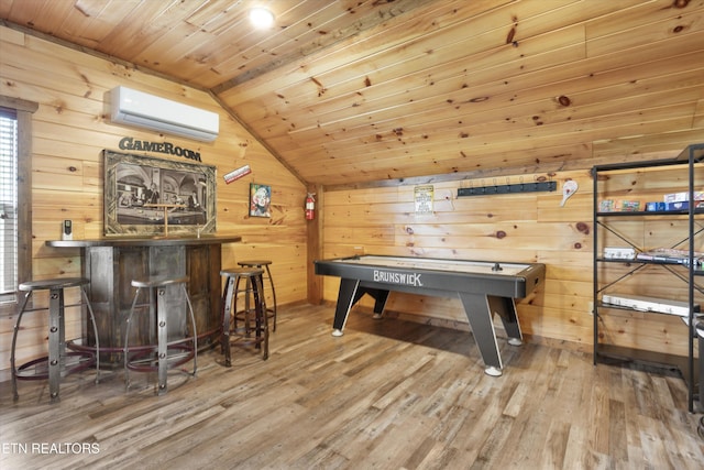 3169 Bear Mountain Ln, Sevierville, TN 37876 - rec room featuring a wall mounted AC, vaulted ceiling, wood finished floors, wood walls, and wood ceiling