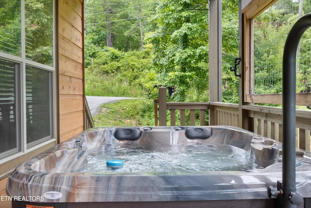 3169 Bear Mountain Ln, Sevierville, TN 37876 - wooden deck with a hot tub and a view of trees