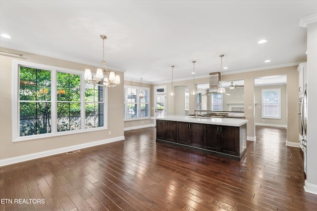 9208 Palomino Way, Knoxville, TN 37922 - kitchen with a chandelier, dark brown cabinetry, light countertops, a kitchen island with sink, and recessed lighting