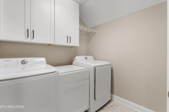 9208 Palomino Way, Knoxville, TN 37922 - laundry room featuring washing machine and dryer, cabinet space, and light marble finish flooring