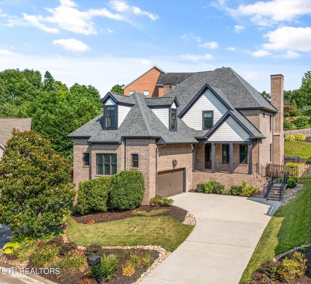9208 Palomino Way, Knoxville, TN 37922 - view of front of house featuring brick siding, driveway, a garage, and roof with shingles