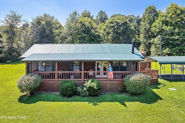 509 Thomas Loop Rd, Sevierville, TN 37876 - view of front of home with a front lawn, covered porch, a detached carport, and a metal roof