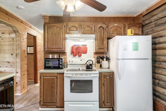 509 Thomas Loop Rd, Sevierville, TN 37876 - kitchen featuring white appliances, under cabinet range hood, ceiling fan, log walls, and a textured ceiling