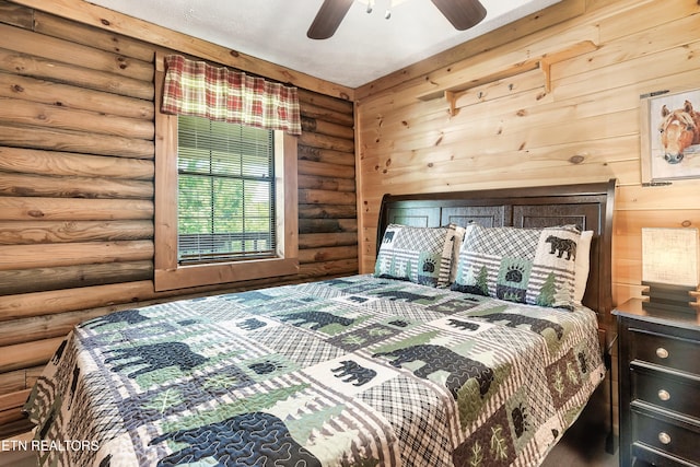 509 Thomas Loop Rd, Sevierville, TN 37876 - bedroom featuring rustic walls and ceiling fan