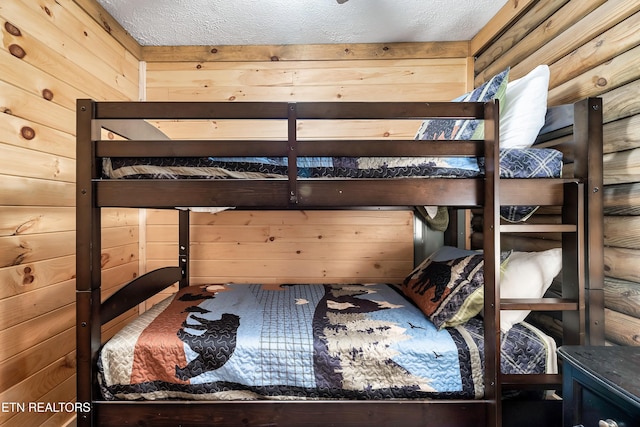 509 Thomas Loop Rd, Sevierville, TN 37876 - bedroom with wood walls and a textured ceiling
