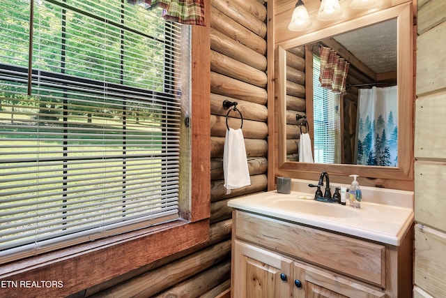 509 Thomas Loop Rd, Sevierville, TN 37876 - full bath with rustic walls, vanity, and plenty of natural light