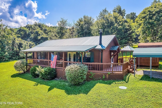 509 Thomas Loop Rd, Sevierville, TN 37876 - rear view of property featuring a yard, a metal roof, and log exterior