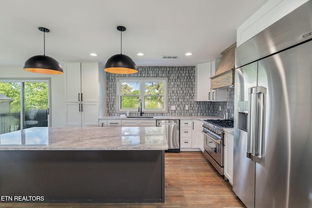 713 Concord Rd, Knoxville, TN 37934 - kitchen featuring high quality appliances, healthy amount of natural light, white cabinets, and recessed lighting