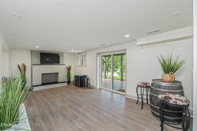 713 Concord Rd, Knoxville, TN 37934 - living area featuring wood finished floors, a brick fireplace, and recessed lighting