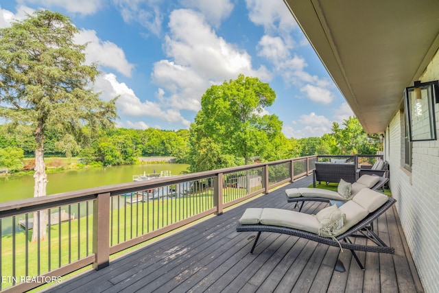 713 Concord Rd, Knoxville, TN 37934 - wooden deck featuring a water view, a lawn, view of wooded area, and an outdoor hangout area