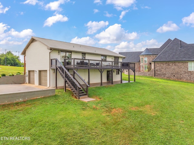 713 Concord Rd, Knoxville, TN 37934 - back of property with a wooden deck, stairs, a garage, concrete driveway, and a lawn
