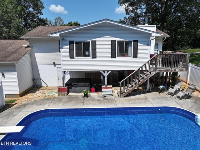 616 Loop Rd, Knoxville, TN 37934 - back of house with a covered hot tub, a patio, stairs, and an outdoor pool