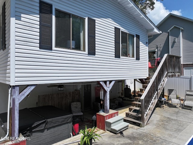 616 Loop Rd, Knoxville, TN 37934 - view of home's exterior with a hot tub, a patio, and stairway