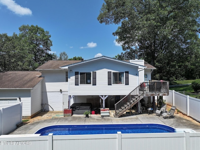 616 Loop Rd, Knoxville, TN 37934 - back of property with a fenced backyard, stairway, and a patio