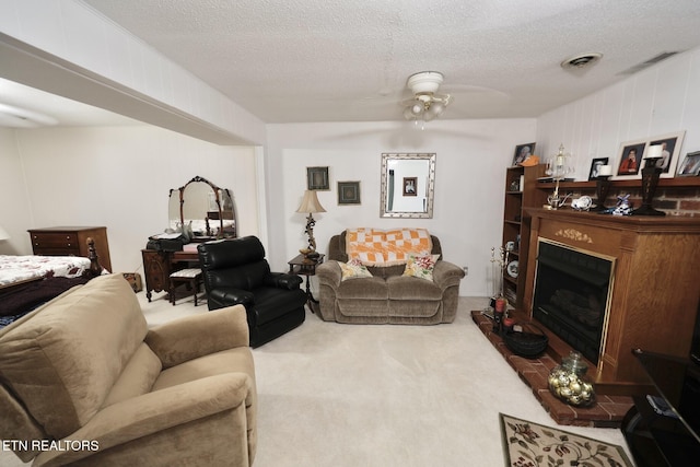 616 Loop Rd, Knoxville, TN 37934 - living room featuring carpet flooring, a fireplace, a textured ceiling, and ceiling fan