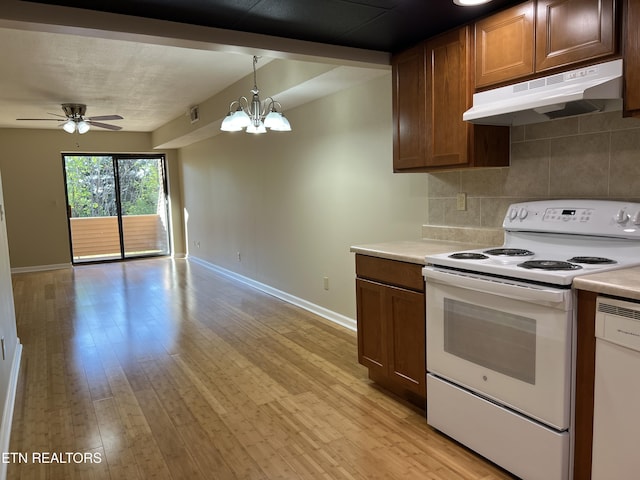 112 Olympia Dr, Alcoa, TN 37701 - kitchen with white appliances, under cabinet range hood, light countertops, ceiling fan, and decorative backsplash